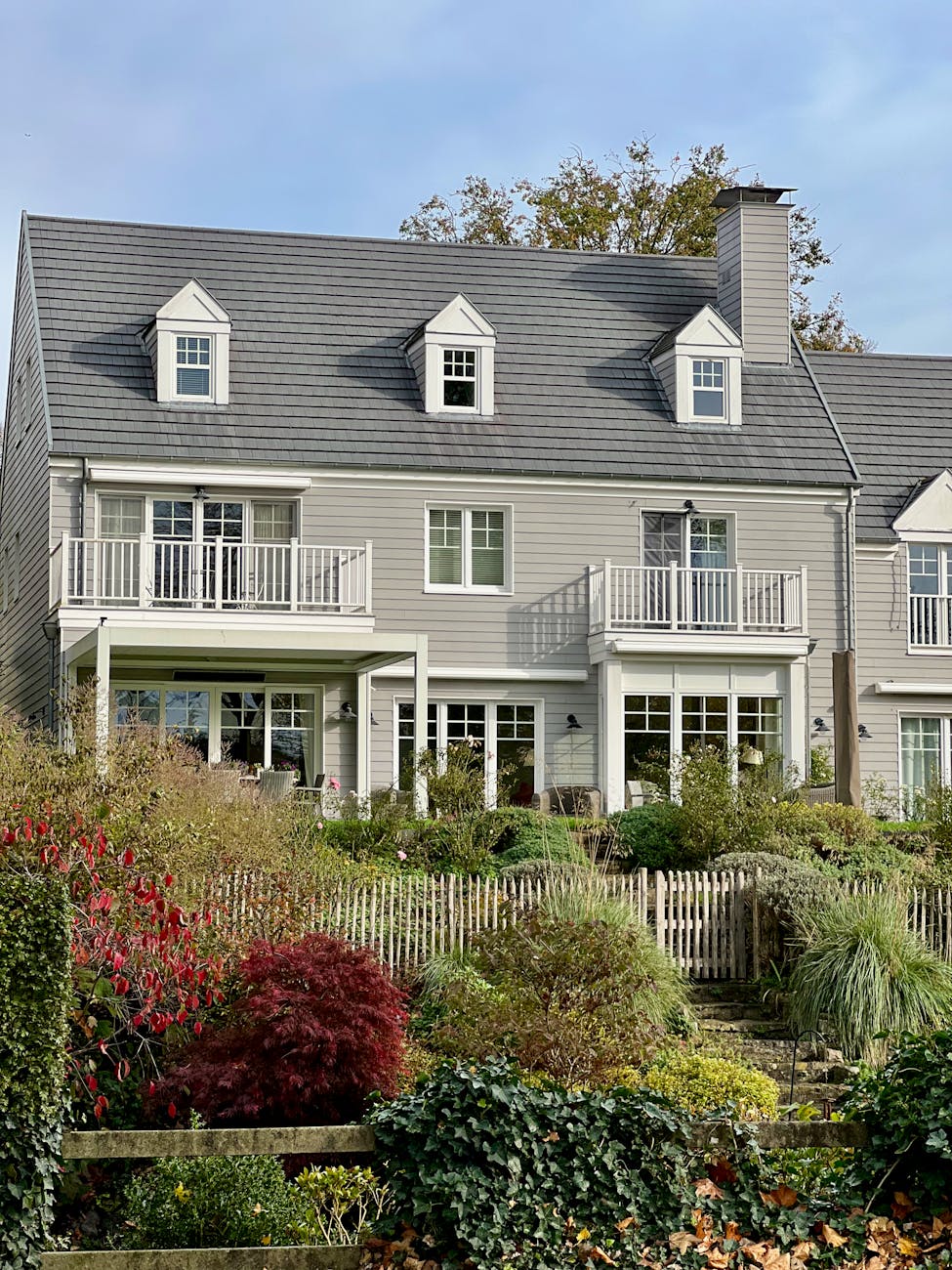 gray wooden house with balconies