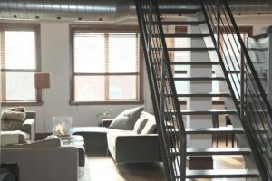 gray couch beside window