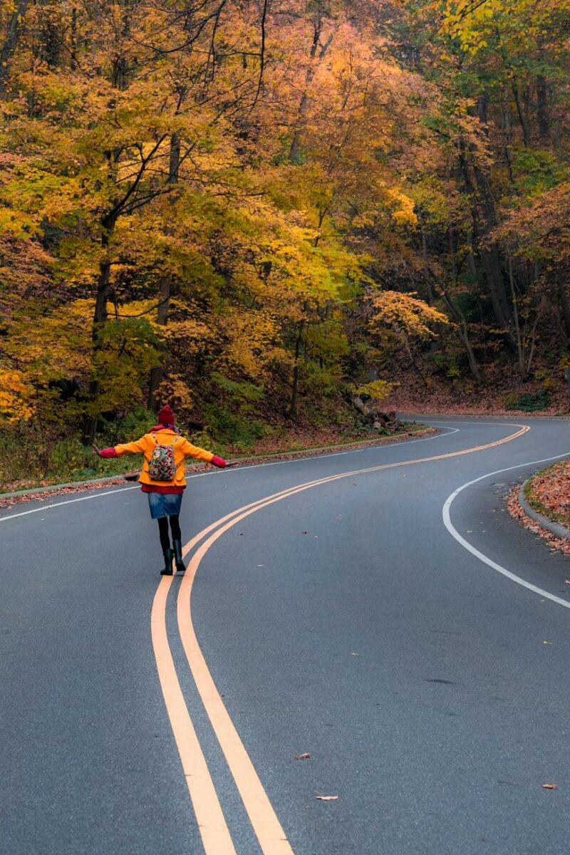 woman walking in middle of road