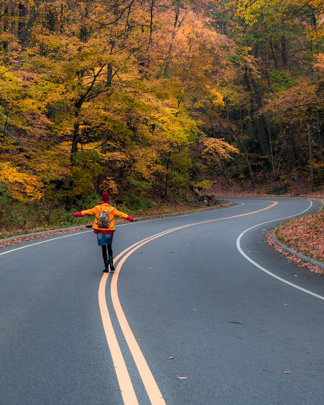 woman walking in middle of road