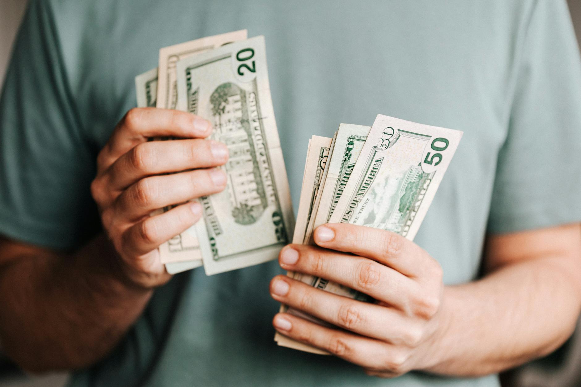 crop man counting dollar banknotes; bug out bag