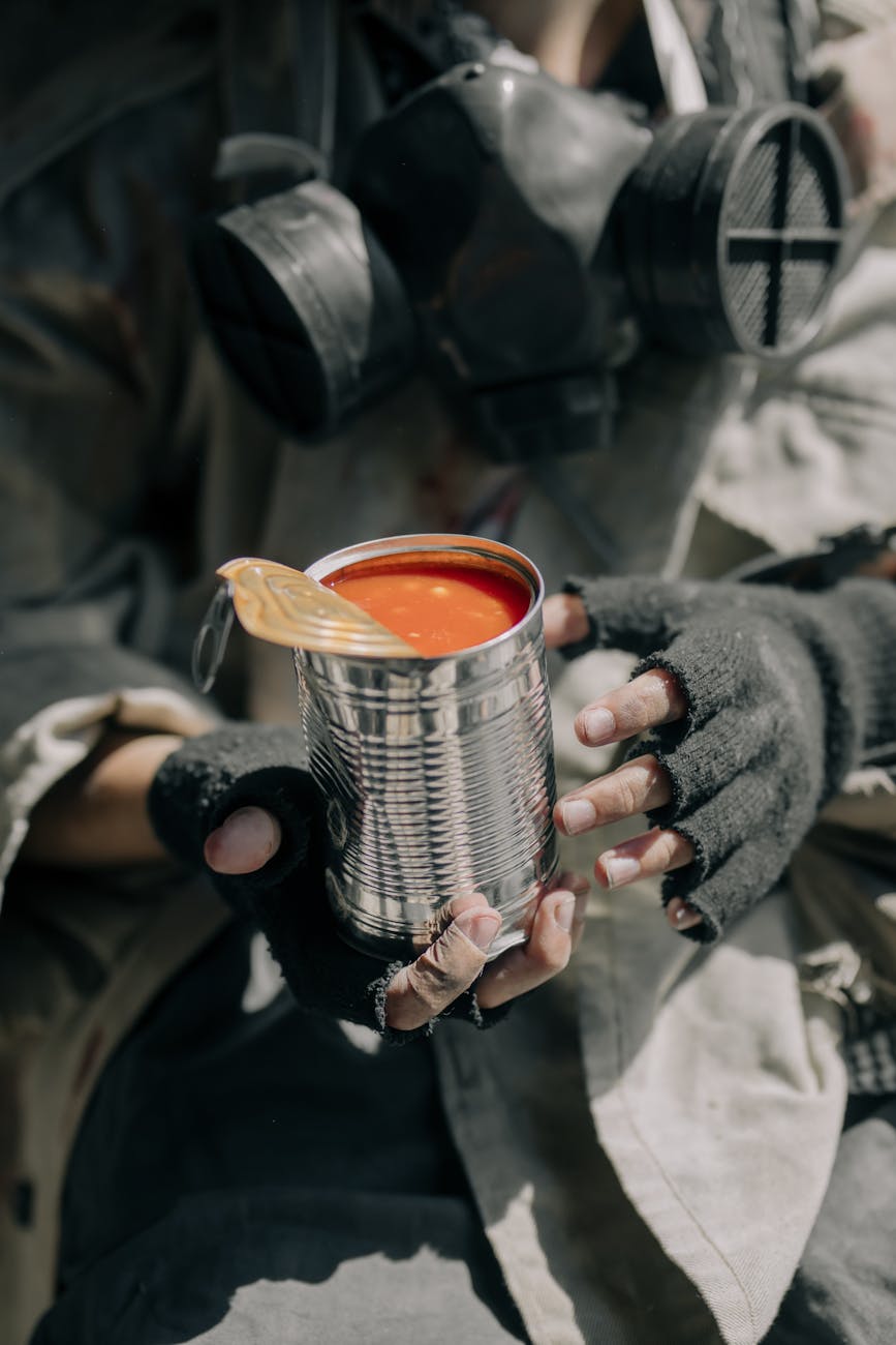 person holding white and black ceramic mug; survival skills