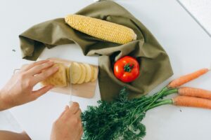 a person slicing a potato