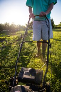 a person mowing the lawn