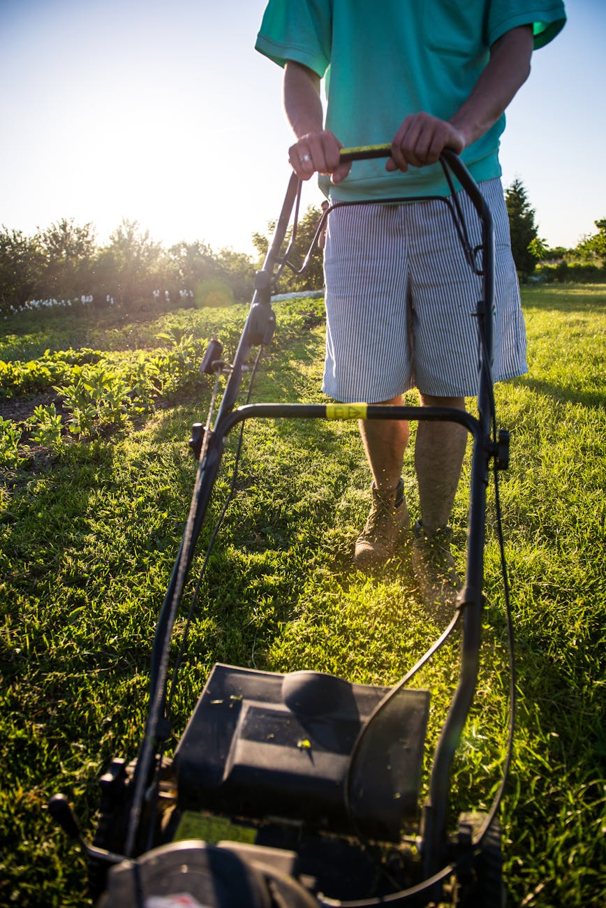 a person mowing the lawn