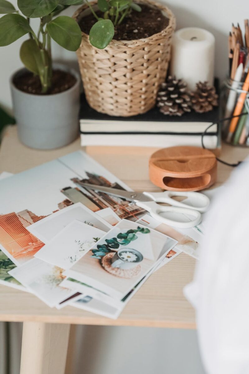 table with various photos and scissors