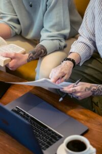 anonymous remote workers sitting on couch and discussing project