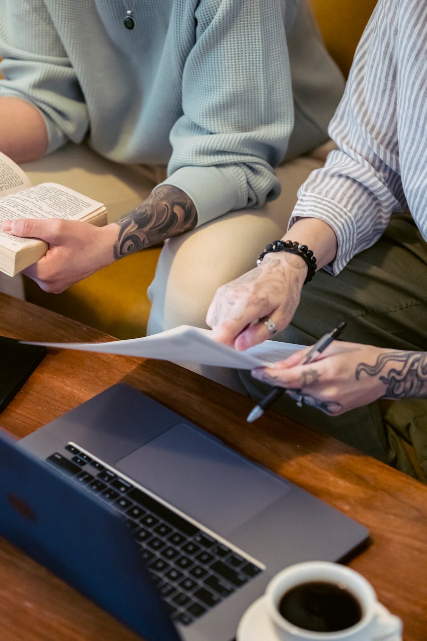 anonymous remote workers sitting on couch and discussing project