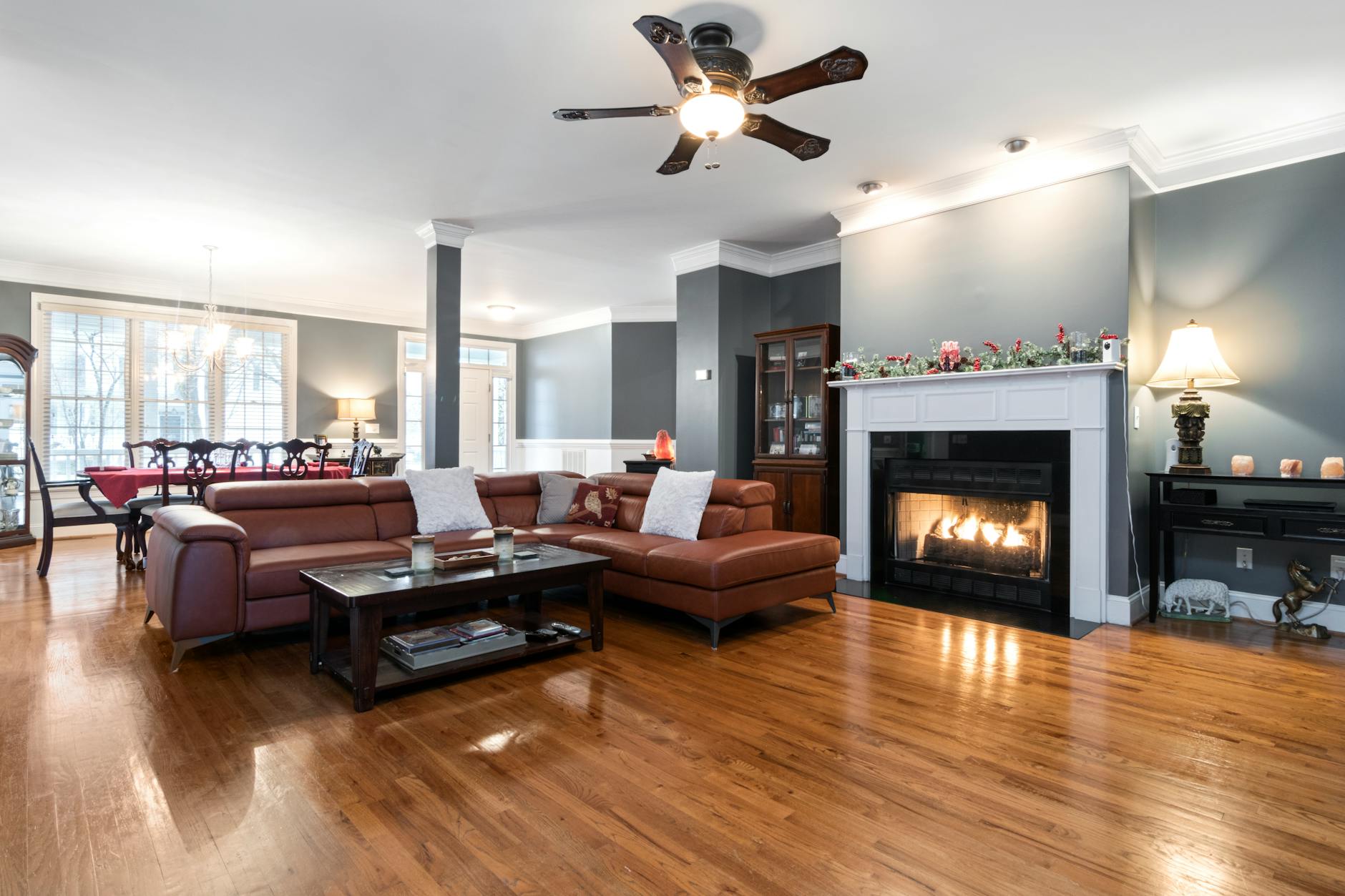 spacious interior with fireplace and shiny wooden floor