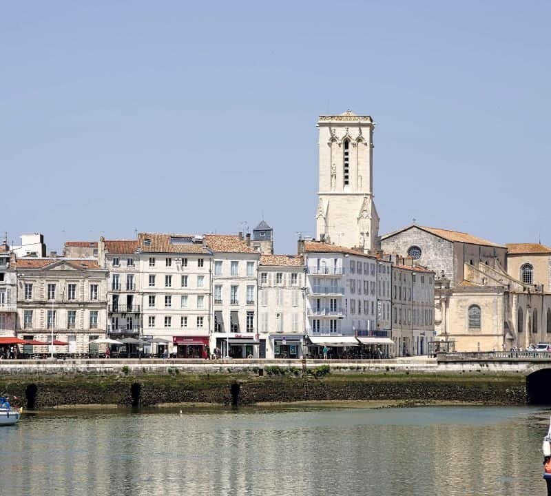 Waterfront view of La Rochelle with historic buildings and boats