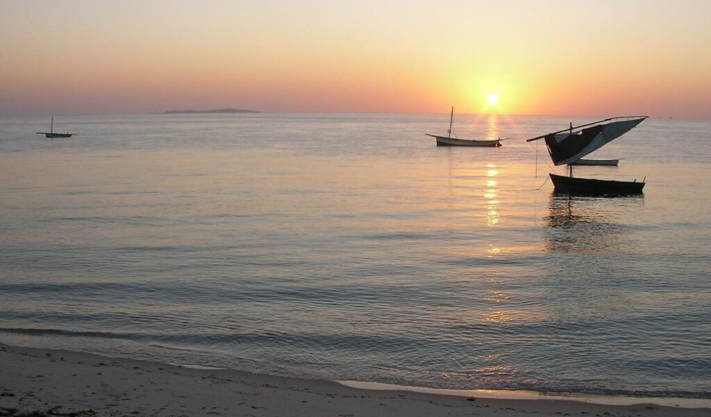 Boats on calm sea at sunrise, Bazaruto Archipelago, Mozambique.