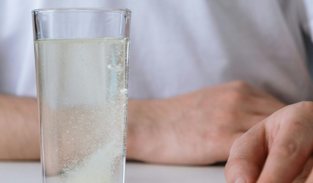 Carbonated beverage in a glass with bubbles, showing the fizz and effervescence of the drink