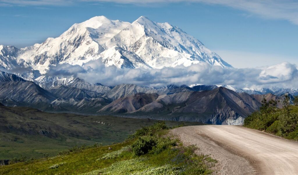 Snow-covered Denali mountain seen from a scenic road in Denali National Park, Alaska.