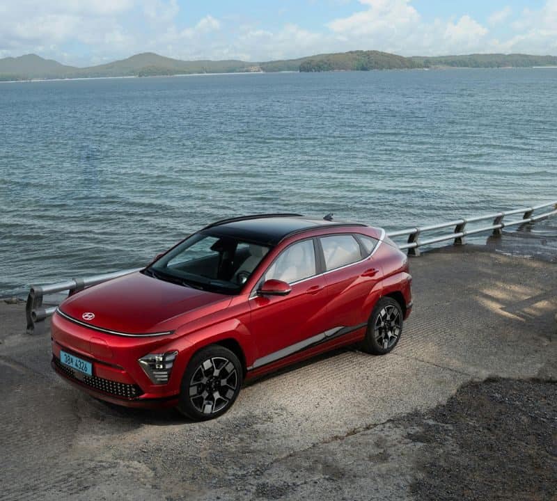 Electric Red Hyundai Kona on Seashore