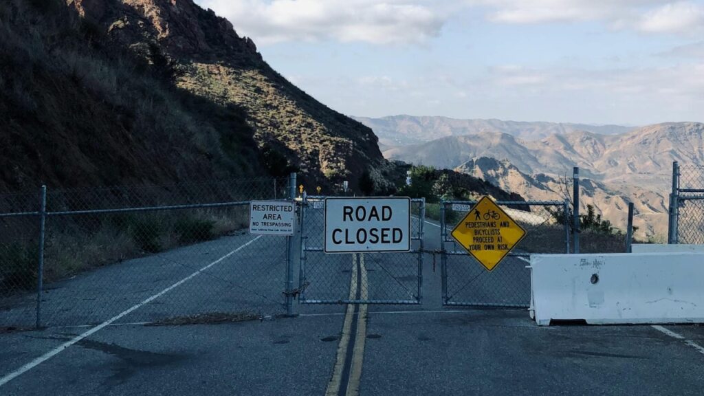 Road closed sign mountain pass