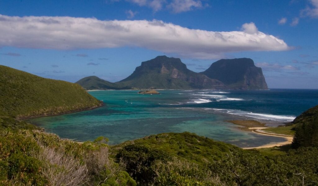 Lord Howe Island, Australia, featuring lush greenery, crystal-clear waters, and iconic mountain peaks.