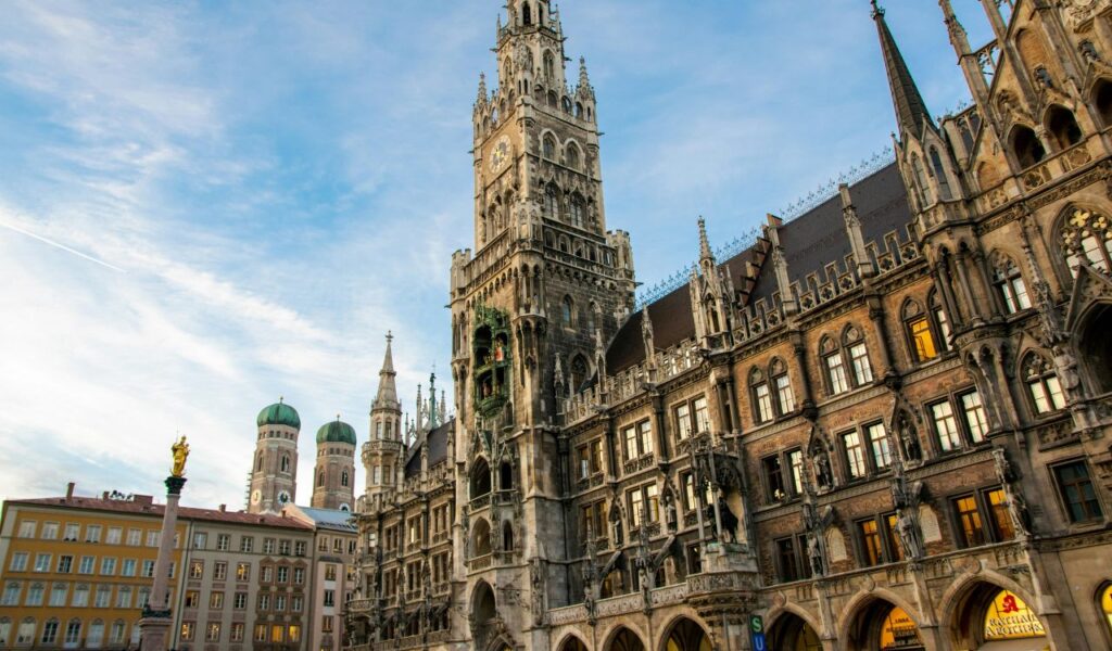 Marienplatz in Munich, Germany, featuring the New Town Hall with its iconic Glockenspiel and Gothic architecture.