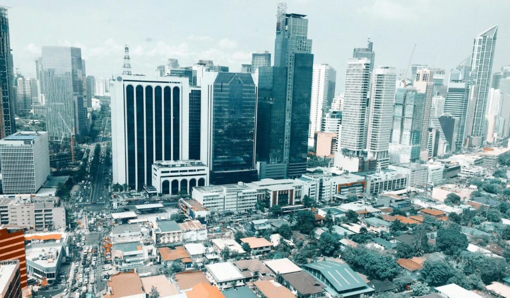 Aerial view of Makati skyline in Metro Manila, Philippines on a sunny day.