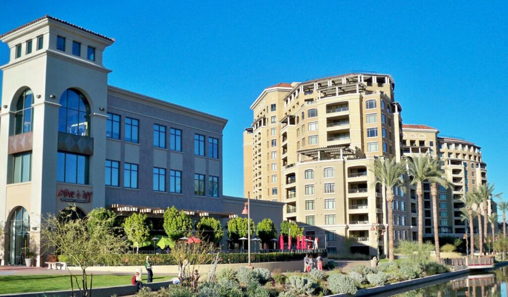 Desert luxury meets urban flair—Scottsdale, Arizona basking under a cloudless sky with palm trees and upscale charm.