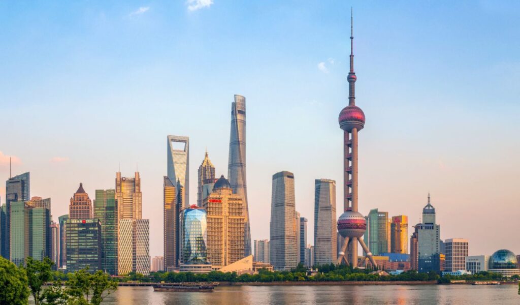 Shanghai, China: A bustling metropolis known for its striking skyline, modern architecture, and vibrant cultural life, symbolizing China's rapid growth.