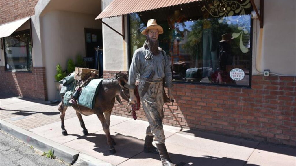 Wickenburg AZ USA. Apr. 24, 2025. It was a rough start for the Town with Indian wars, mine closures, desperados, drought, and a disastrous flood in 1890 when the Walnut Creek Dam burst. Street statues
