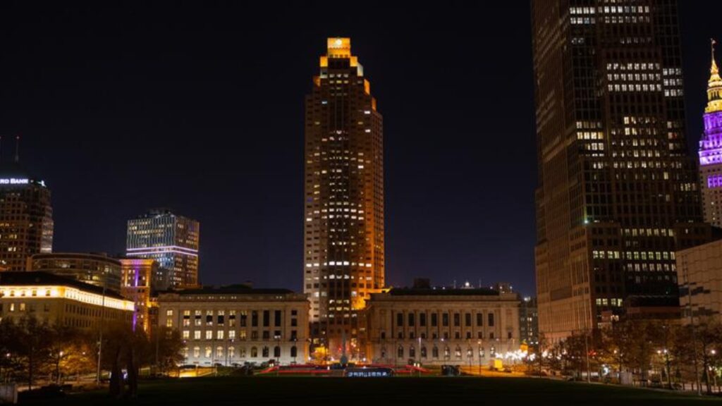 Cleveland, OH / USA - November 20 2020: Late night panorama / skyline shot of Cleveland Downtown with iconic landmarks and buildings