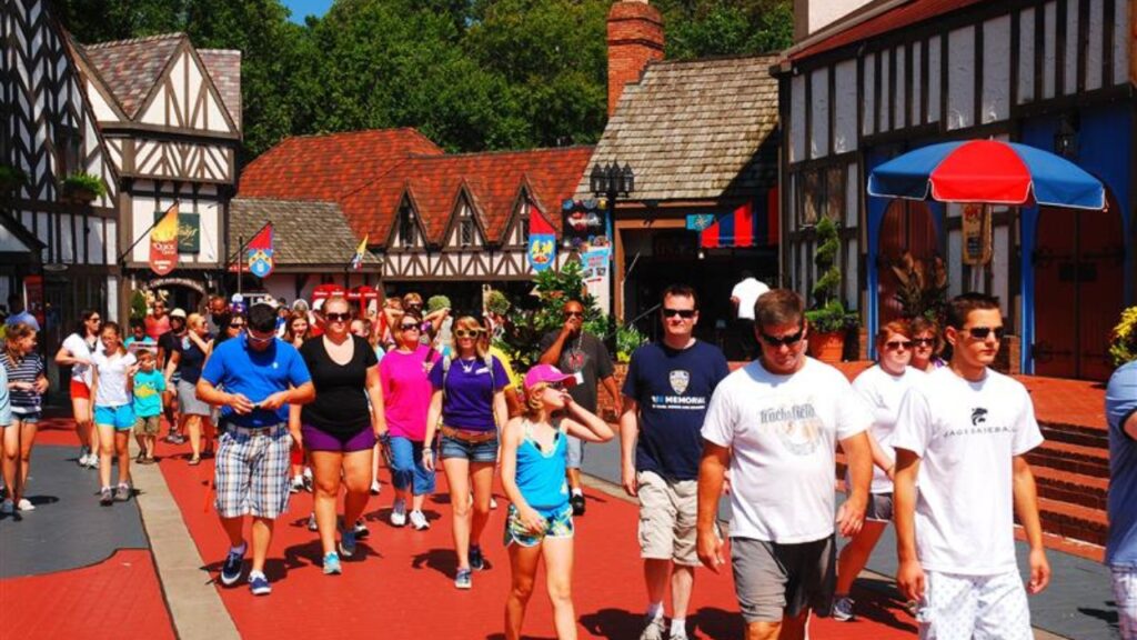 Williamsburg, VA, USA August 2 A crowd of people make their way through a recreated Tudor Village in Busch Gardens, in Williamsburg, Virginia
