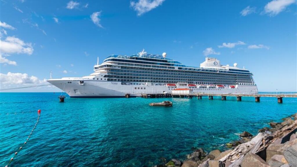Roseau, Dominica - November 24, 2023: Side view of beautiful cruise ship Oceania Cruises Vista in port of Roseau, Dominica
