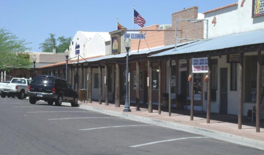 Historic downtown Wickenburg, Arizona with old-style buildings and parked cars
