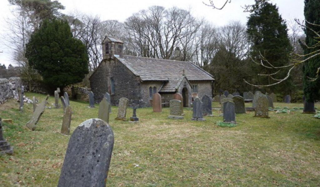 Chapel on the Hill in North Yorkshire, a stone-built former chapel surrounded by gravestones and trees, now a guest retreat.