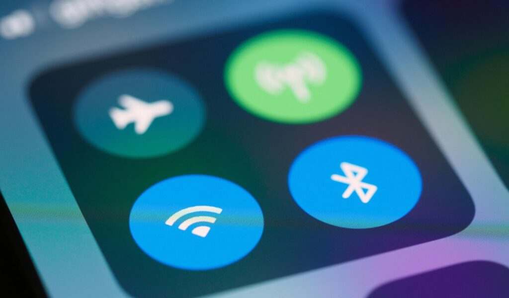 Close-up of a smartphone screen showing control panel icons for airplane mode, Wi-Fi, mobile data, and Bluetooth.