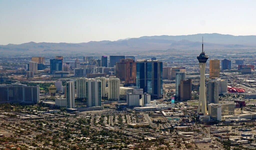 Aerial view of Las Vegas with the Stratosphere Tower and city buildings under daylight.