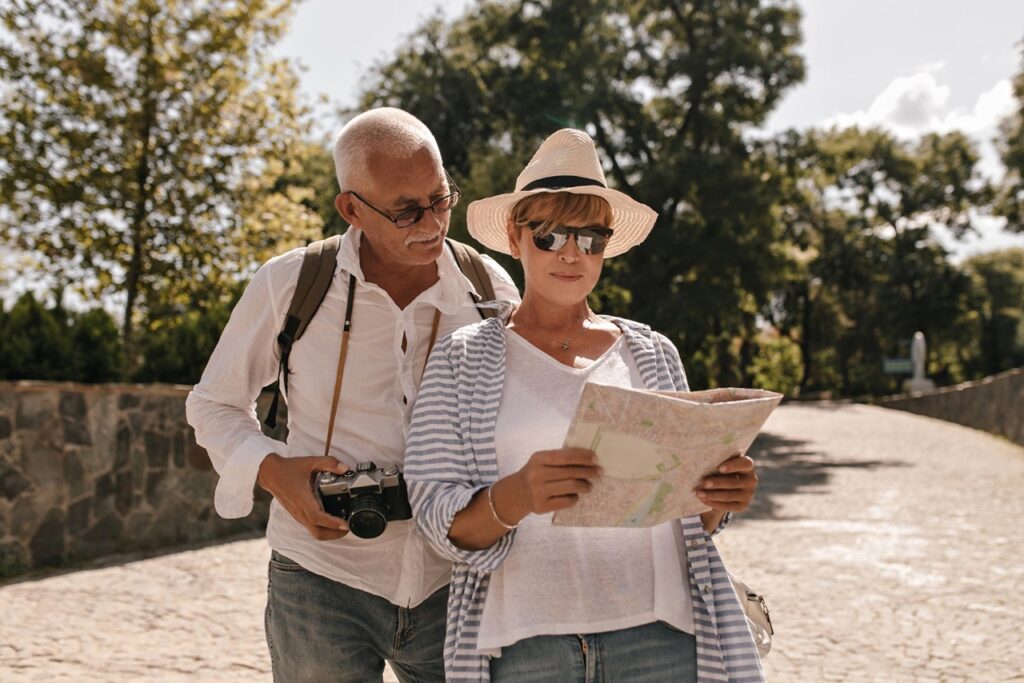 senior travelers with map