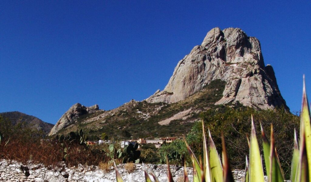 Peña de Bernal, Mexico, is a UFO hotspot known for mysterious lights and encounters near its towering monolith.