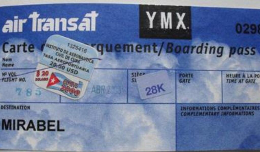 Air Transat boarding pass with flight details, including destination, flight number, seat, and a customs sticker.