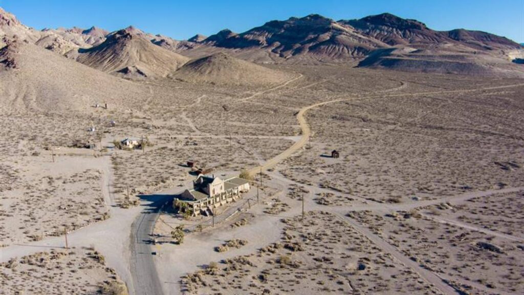 Aerial view of the abandoned ruins of Rhyolite mining camp in the Nevada desert. This Ghost town sits just outside the entrance to Death Valley National Park.