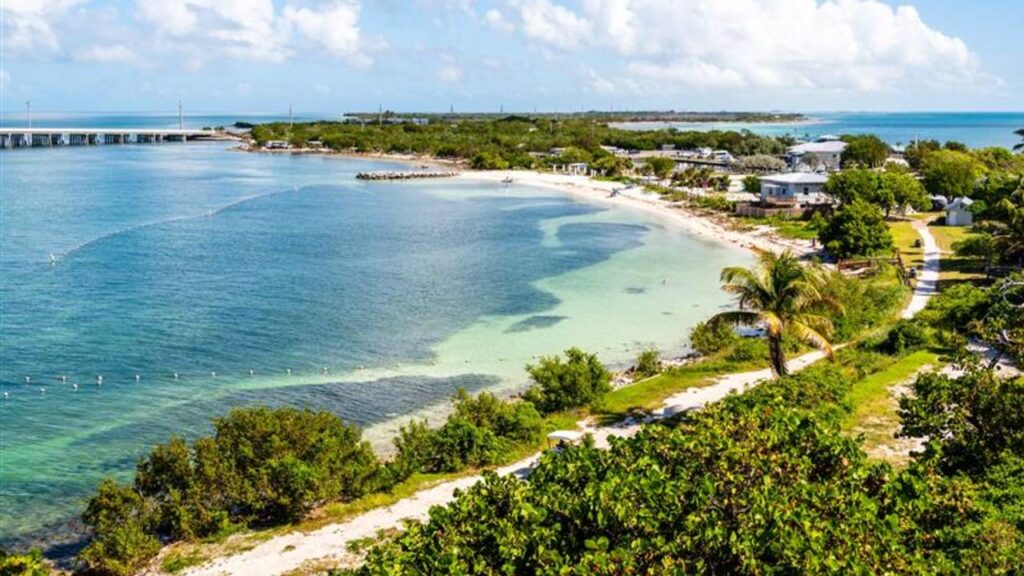 The aerial view of the crystal clear blue water by the beach at Bahia Honda State Park, Big Pine Key, Florida, U.S.A