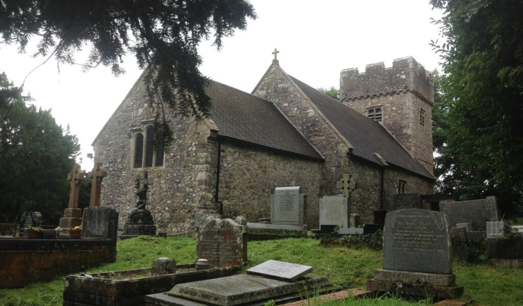 St. Curig’s Church in Wales, a 19th-century stone building with gravestones, now transformed into a unique guesthouse stay.
