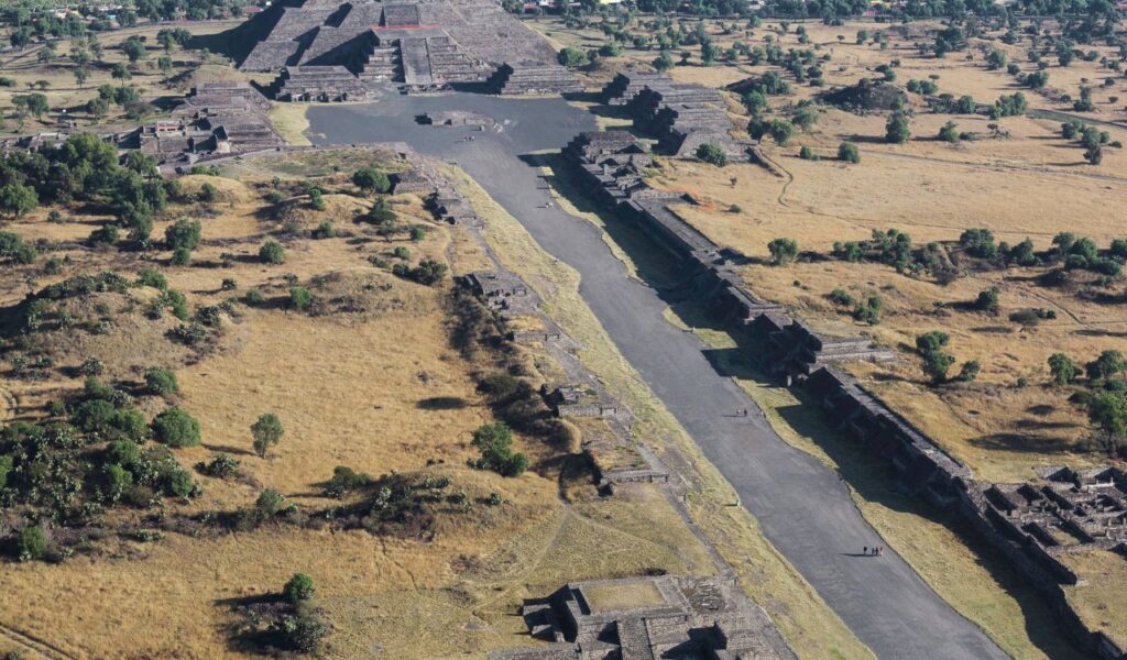 Aerial view of Teotihuacan in Mexico showing the Avenue of the Dead leading to the Pyramid of the Moon.
