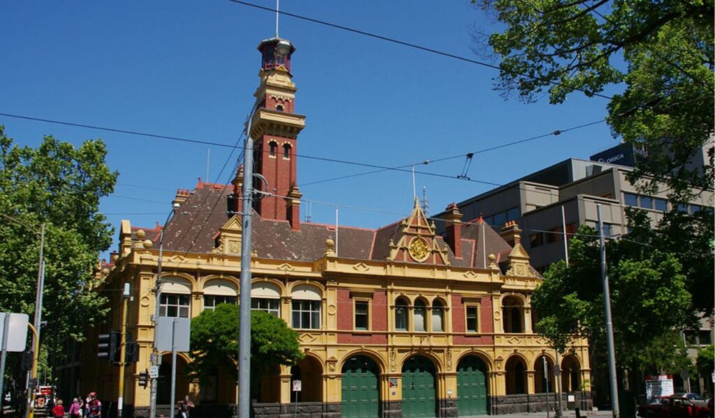 Historic fire station in Melbourne with ornate yellow-red brickwork, now converted into a modern multi-level urban stay.