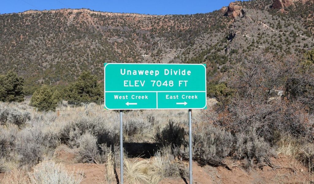 Road sign at Unaweep Divide showing elevation and directions to West and East Creek.