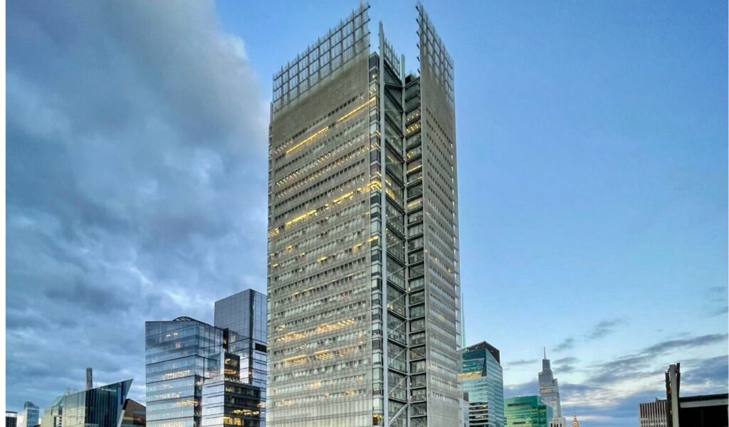 The New York Times Building in Manhattan, a sleek and modern high-rise with a steel frame and ceramic rod facade, stands tall among the city's skyline.