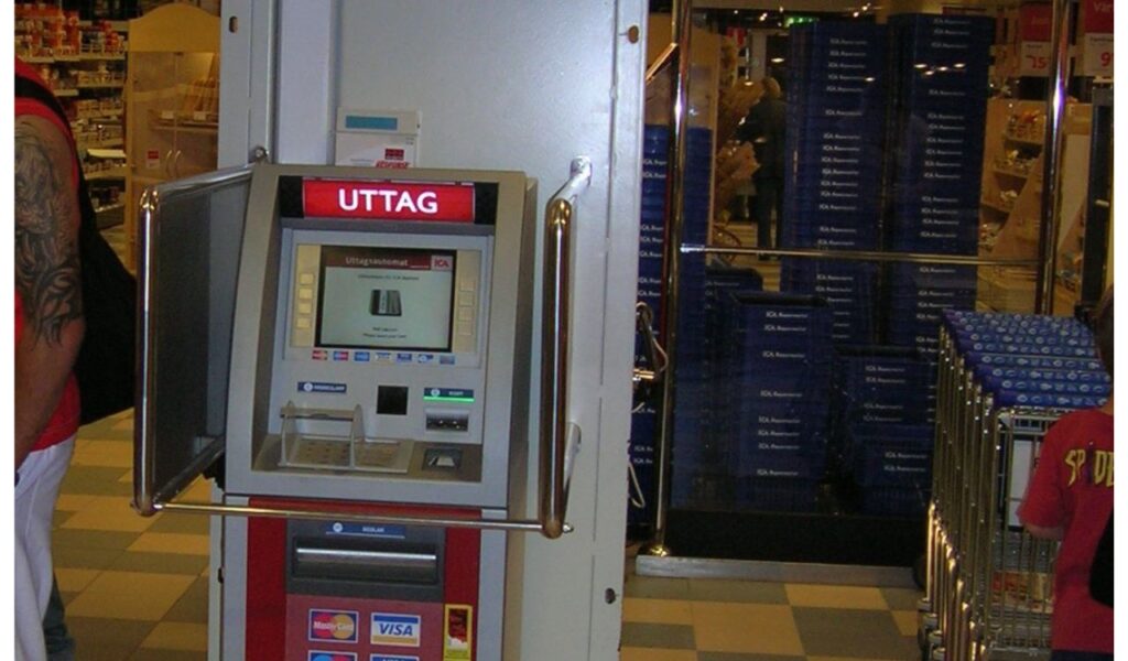 It looks like you've uploaded an image of an ATM, possibly located inside a store. Is there anything specific you would like to know or discuss about this ATM or its usage?