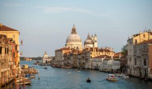 Grand Canal in Venice with boats and Santa Maria della Salute basilica.