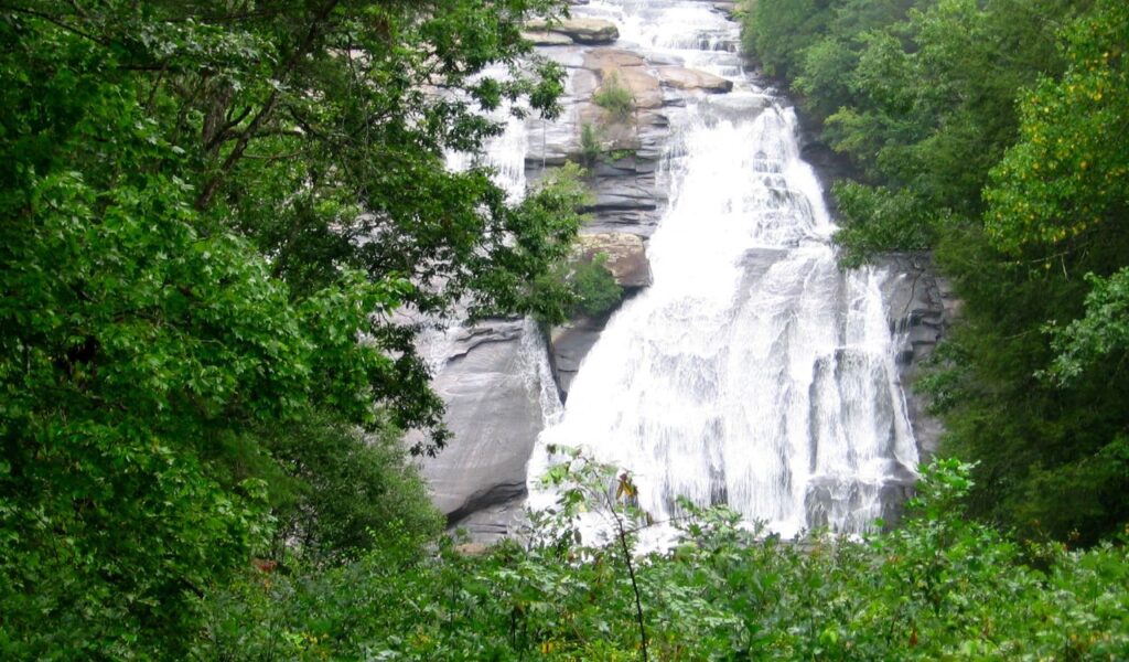 High Falls pouring over wide rock face in DuPont State Forest, North Carolina