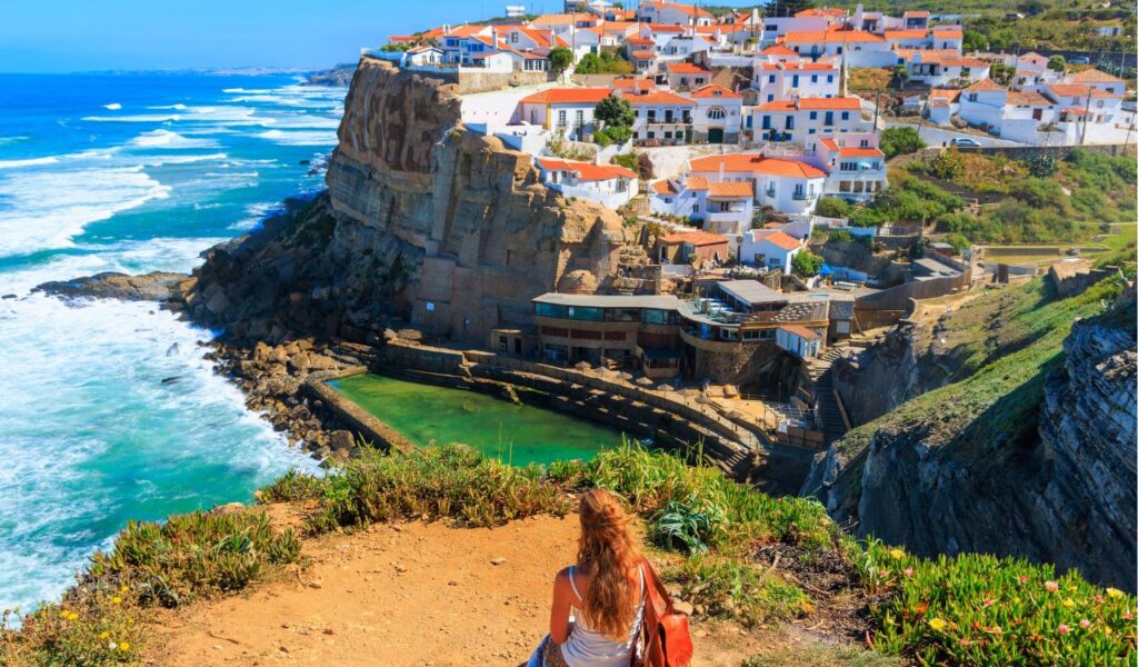 Azenhas do Mar, back view of woman tourist in Sintra, Portugal