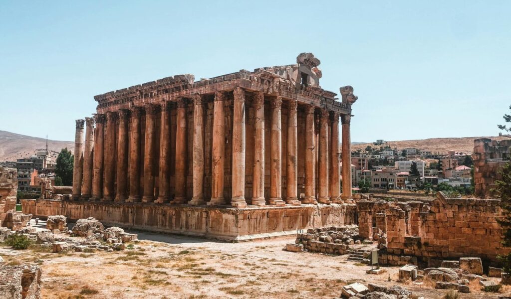 Baalbek, Lebanon a remarkably preserved Roman temple with towering Corinthian columns, intricate stone carvings, and grand ancient architecture.