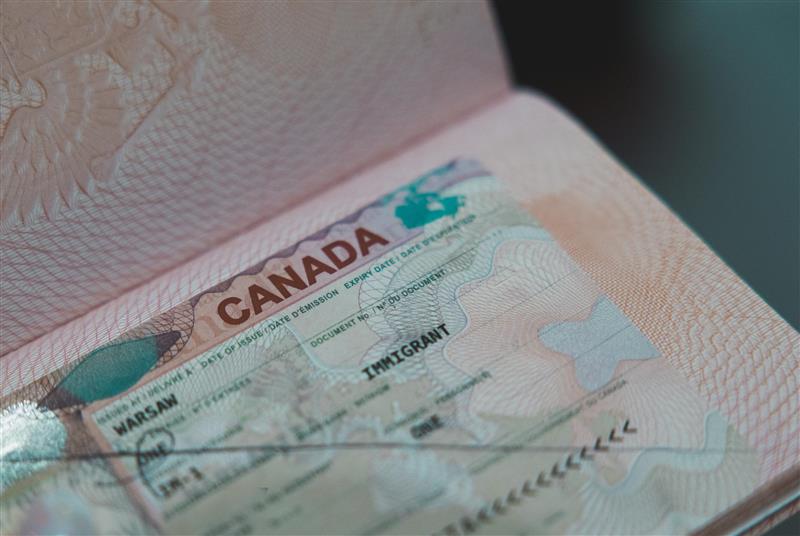 Vancouver, Canada - March 18,2025: Closeup of a Canadian immigration document showing security features and official markings