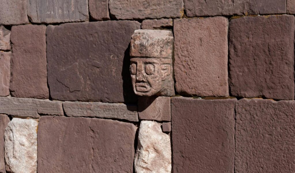 Puma Punku in Bolivia a mysterious ancient site with precisely cut stone blocks, part of the Tiwanaku complex, showcasing advanced engineering skills from a pre-Inca civilization.