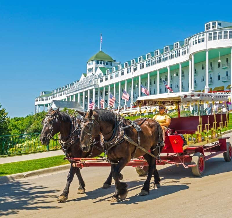 The Grand Hotel on Mackinac Island Michigan showing horse and buggy ride located on Lake Huron, Michigan. created 07.08.23